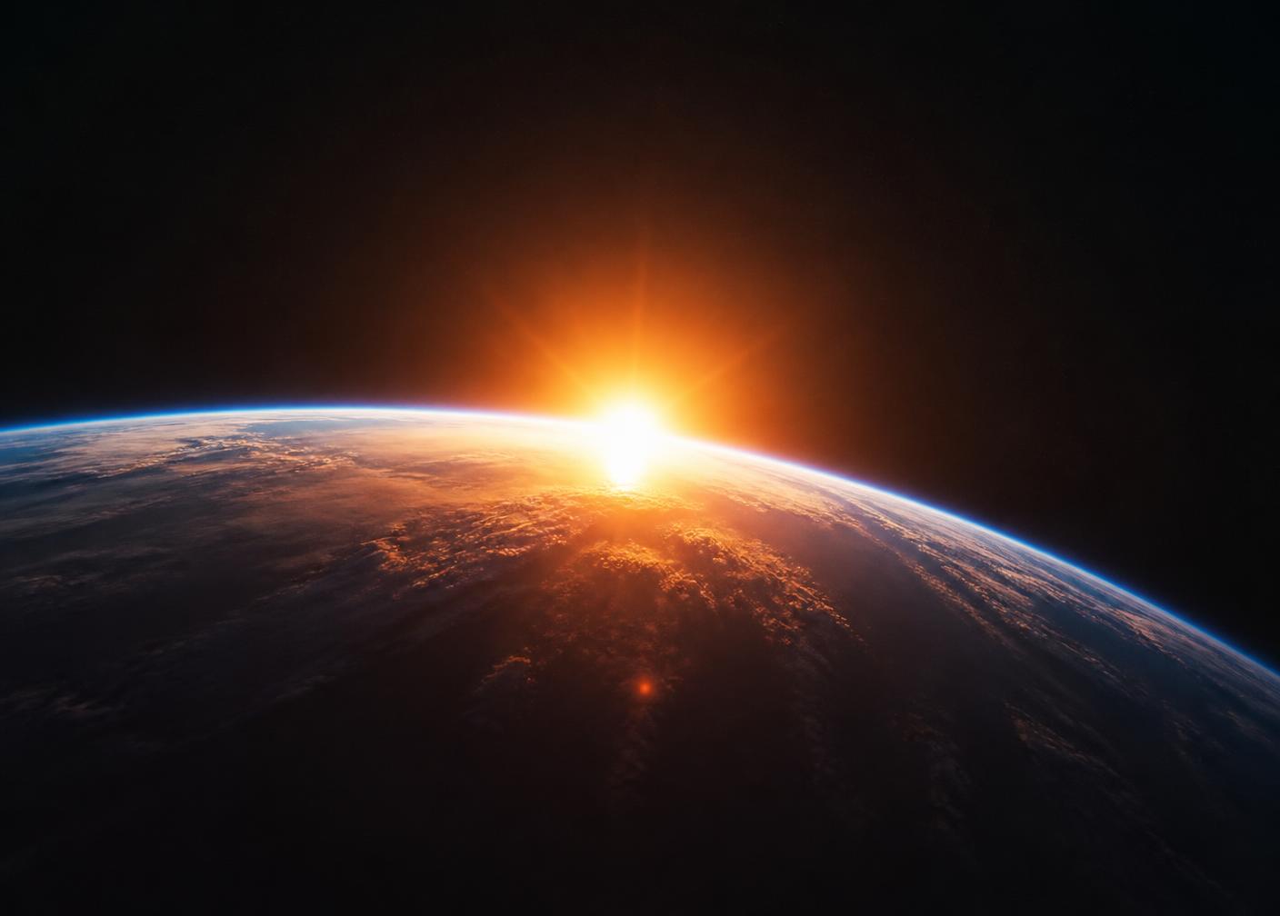 Lever de soleil orange sur la courbure de la Terre vue depuis l'espace